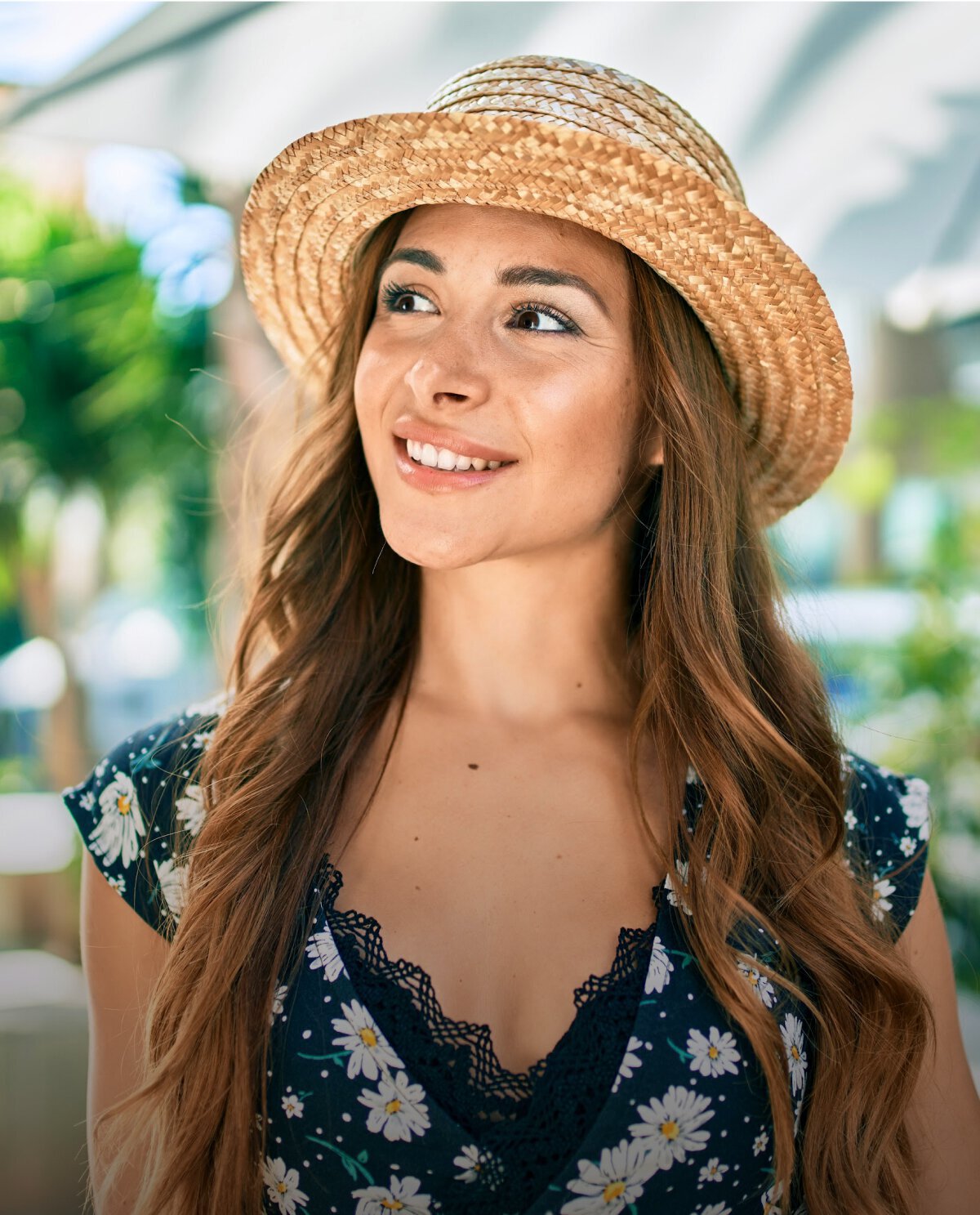 Beautiful woman outdoors wearing hat
